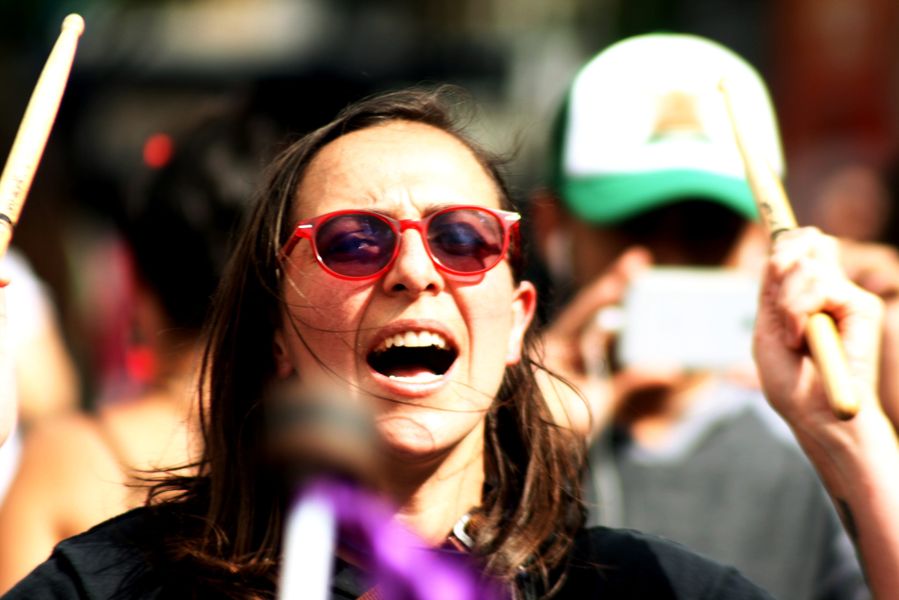 Activist Playing Snare Drum in Demonstration