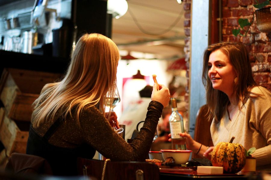Female Friends Eating Together and Talking